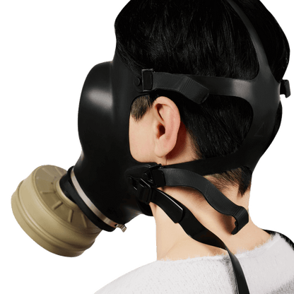 Side view of Israeli CBRN gas mask showing adjustable elastic straps and secure head fit